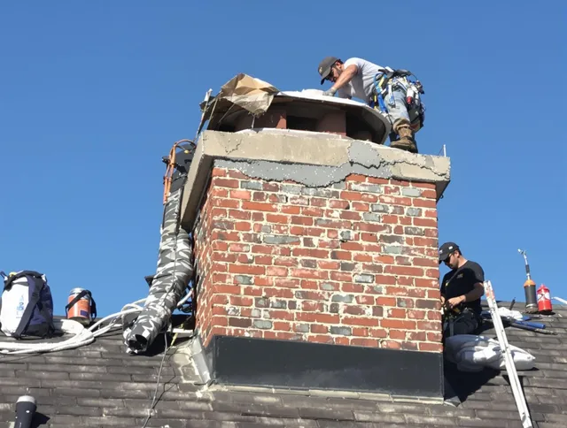 Stow Chimney Sweep installing a custom chimney crown in Stow, OH
