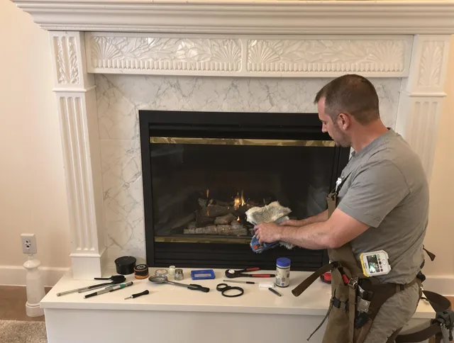 Stow Chimney Sweep performing fireplace maintenance in Stow, OH