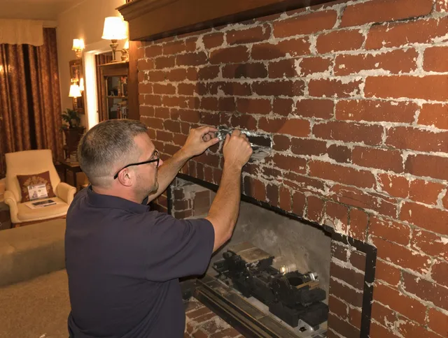 Stow Chimney Sweep expert fixing a fireplace in Stow, OH